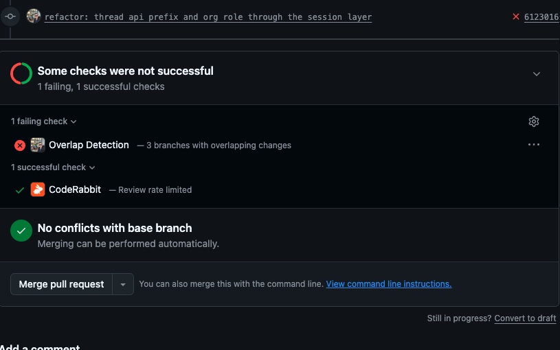 A GitHub pull request showing two results stacked: a failing check reading “Overlap Detection - 3 branches with overlapping changes”, and directly beneath it GitHub’s own green “No conflicts with base branch, merging can be performed automatically”.